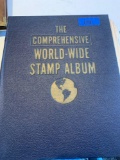 The comprehensive world wide stamp album. Partial collection 100+/- stamps