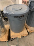Brute trash can on wheels full of sand