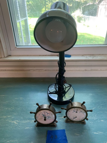 Antique barometers and desk lamp