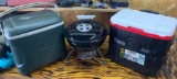 Weber charcoal grill and Igloo 42 can wield cooler and an additional green cooler