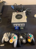 Nintendo game cube gaming system With remote controls and two memory cards