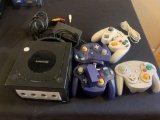 Nintendo game cube gaming system with three wireless remotes and one corded remote