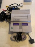 Super Nintendo entertainment video game system with all chargers plug-ins and one remote