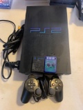Playstation 2 video game system with power cords and one remote also two memory cards