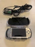 Play station PSP video game system with outer case and charger works great
