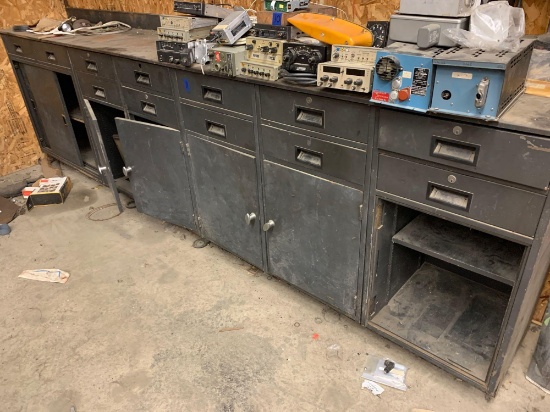 Approximately 10 foot tool bench with cabinets and drawers