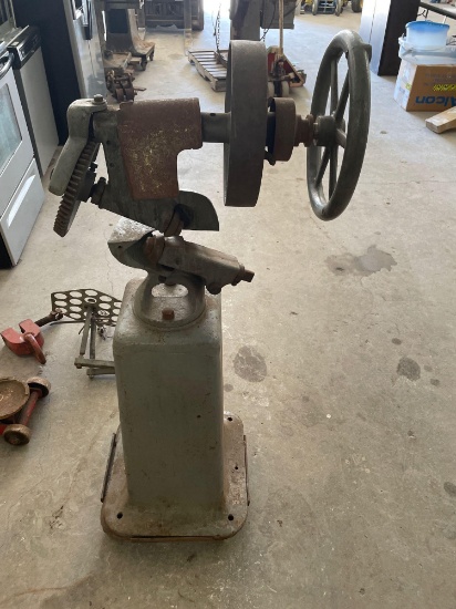 Metal shaping tool on stand