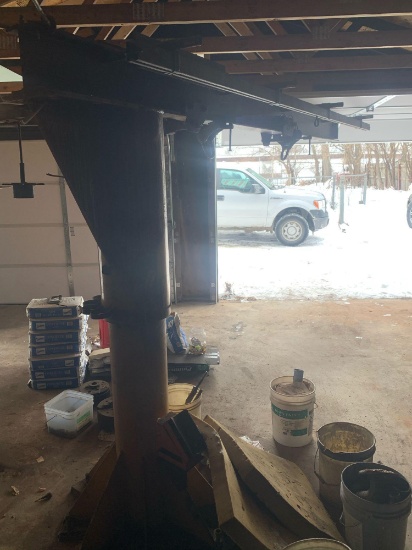 Rotating pivoting arm approximately 6.5 ft tall and arm swings 12 feet
