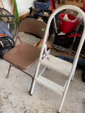 Two-step step ladder and a folding chair