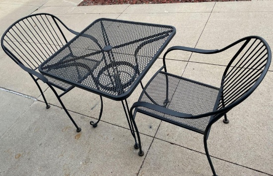Rod iron table with two chairs