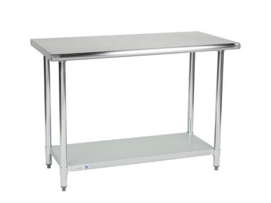 Stainless steel prep table 4ft x 24in deep countertop height Stock photo.