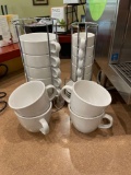 Coffee mugs and espresso cups with plates in more