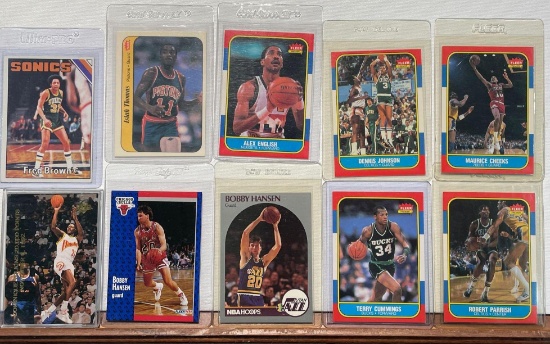 Assorted basketball cards including Cheeks, Parrish, Thomas, Hansen plus