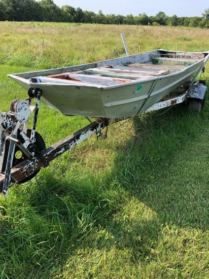 24. 16 ft boat on a trailer. No title