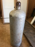 # 7 Propane Gas Tank 4 feet tall; believe 100 pounds size