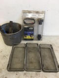 Baskets, paintbrushes and combustion leak indicating fluid