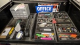 whole shelf full of organizers, bolts, utility knives, battery terminal items drill bits plus