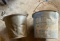 Two large galvanized or a metal buckets one says dairy maid for calves and pigs