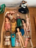 box of old celluloid dolls