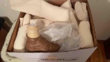 box of cloth and ceramic doll parts