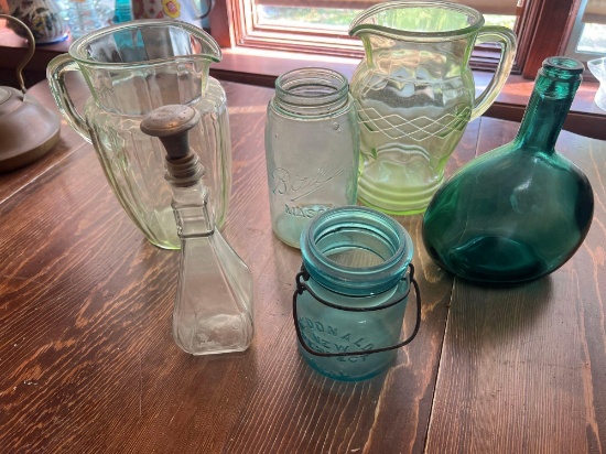 Green depressionware pitchers and other glass