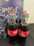 four pack of Coca-Cola, and sign basket and more