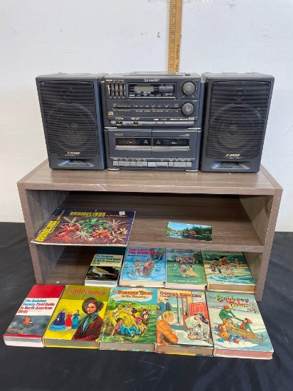 vintage boombox CD radio, books, shelf