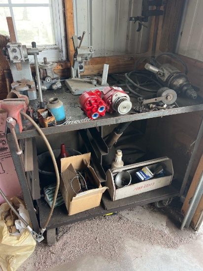 cart with vices, old oil cans, parts and pieces