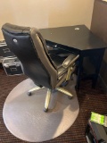 corner desk with nice office chair and floor mat