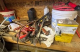 items under workbench.: hammers, clamps, tools