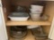 Cabinet full of baking dishes and pans