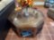 Interesting glass top table with some sort of metal under glass