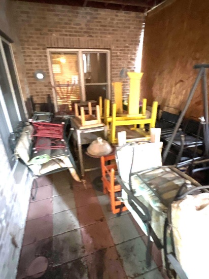 Patio full of lawn furniture and cast-iron and more!