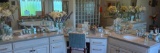 Upstairs master bathroom decor - items and flowers on counters! floral bench