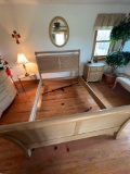 Queen sized bed frame and two nightstand tables