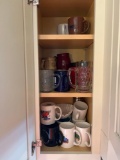 Cabinet's full of mugs, plates and glasses