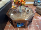 Interesting glass top table with some sort of metal under glass