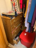 Closet of clothes and dresser, with misc things