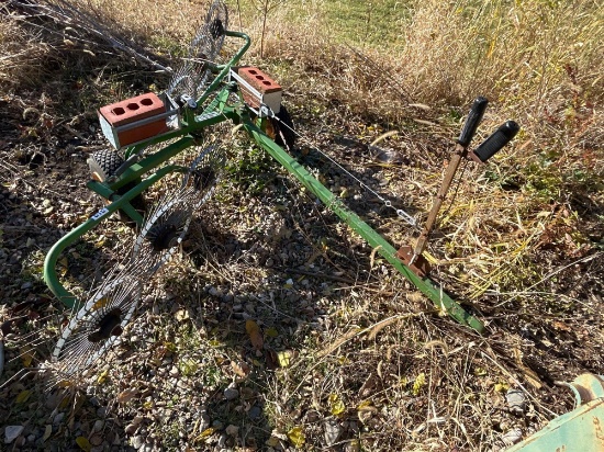 Estate rake to be pulled behind a riding mower