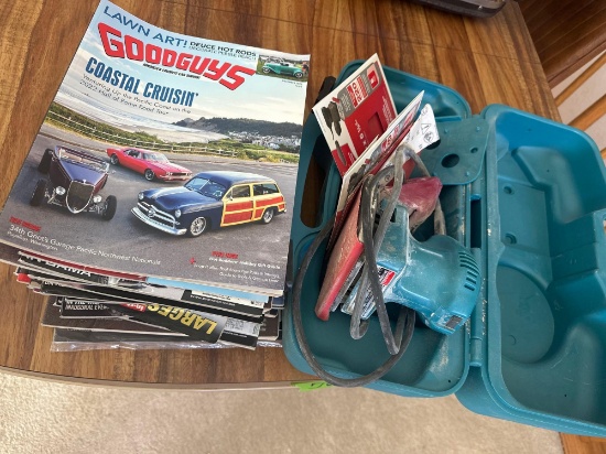 Makita, sander and stack of automotive magazines 2000's