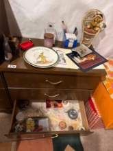 Small Wood-Tone Three-Drawer Chest with Assorted Contents