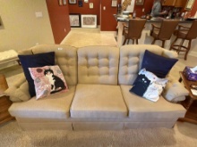 Beige Tufted Loveseat with Assorted Accent Pillows