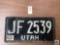 Utah 70's era white on black license plate