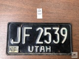 Utah 70's era white on black license plate