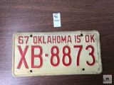 1967 red lettering Oklahoma is Okay license plate