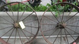 TWO LARGE IRON WHEELS