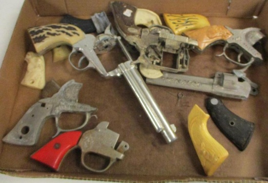 FLAT ASSORTED CAP GUN PARTS AND PIECES