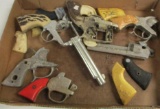 FLAT ASSORTED CAP GUN PARTS AND PIECES