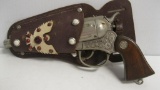 TOY HOLSTER AND RESTLESS GUN CAP GUN