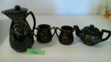 Dark brown pottery tea set